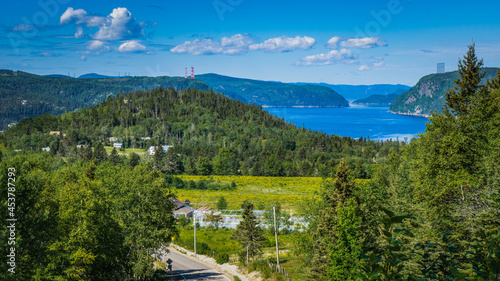 View on the Saguenay Fjord and the Anse de Roche rock from a belvedere near the small village of L'Anse De Roche in Quebec (Canada) photo