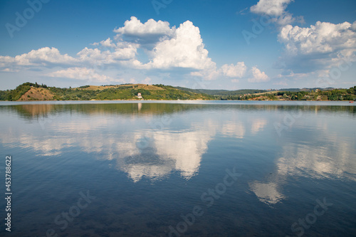 beautiful background of blue lake and sky reflection