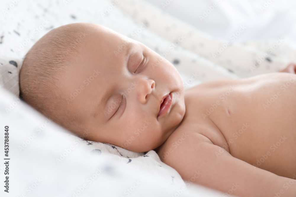 Cute little baby sleeping on bed, closeup Cute little baby sleeping on bed, closeup