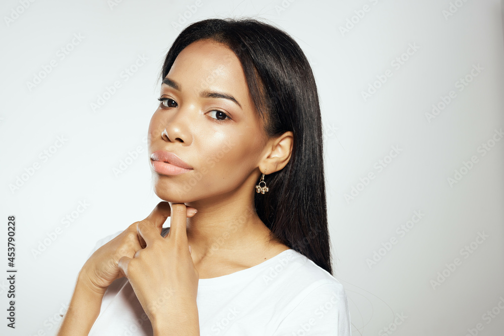 woman with black long hair cosmetics jewelry earrings woman with black long hair cosmetics jewelry earrings