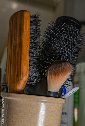 Hairbrush and powder brush in the bathroom 