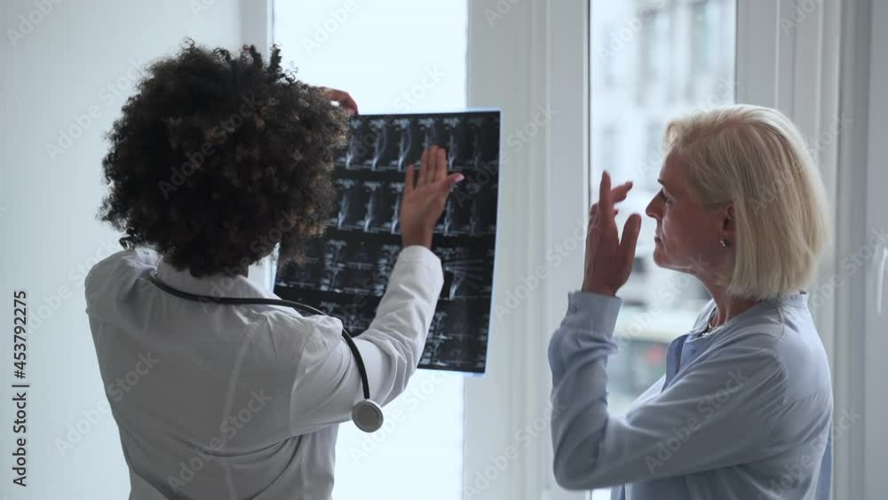 Neuropathologist Doctor traumatologist consultation. Spbas Skilled African-American ...