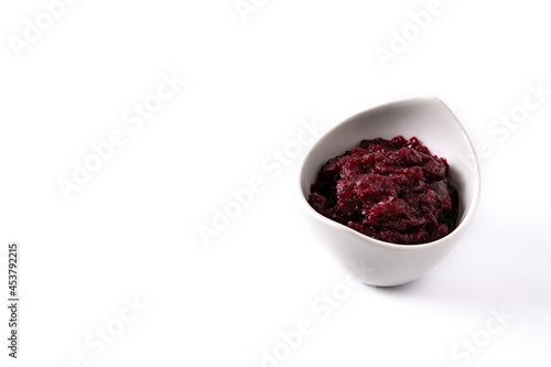Beetroot sauce in white bowl isolated on white background. Copy space
