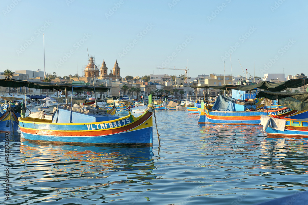 Luzzu boats in Malta harbor in Marsaxlokk village.