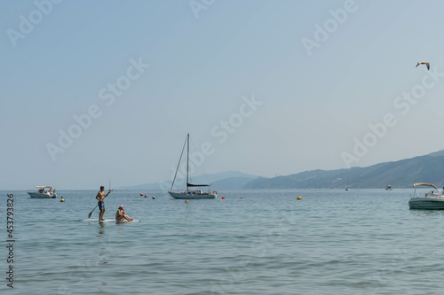 Couple paddling in the sea