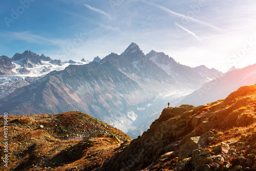 Amazing view on Monte Bianco mountains range with tourist on a foreground. Vallon de Berard Nature Preserve, Chamonix, Graian Alps. Landscape photography