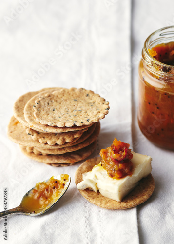 Spiced chutney with homemade crackers and cheese photo
