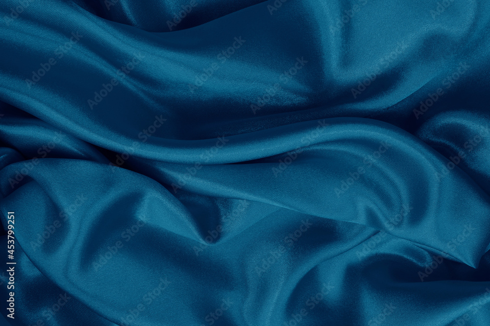 Fototapeta premium Dark blue fabric cloth texture for background and design art work, beautiful crumpled pattern of silk or linen.