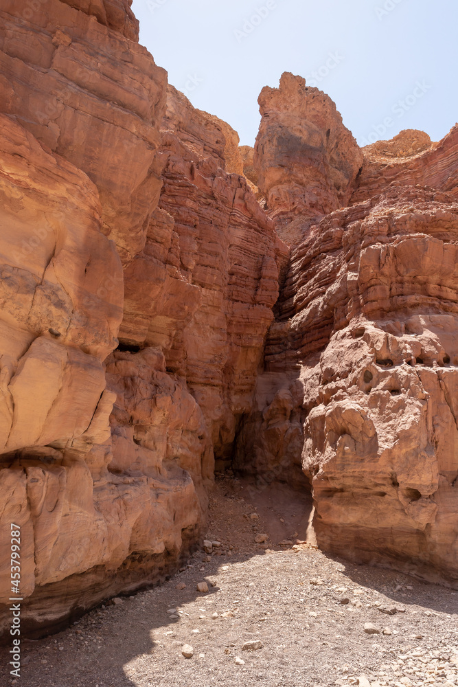 Narrow  passage between rocks in a nature reserve near Eilat city - Red Canyon, in southern Israel