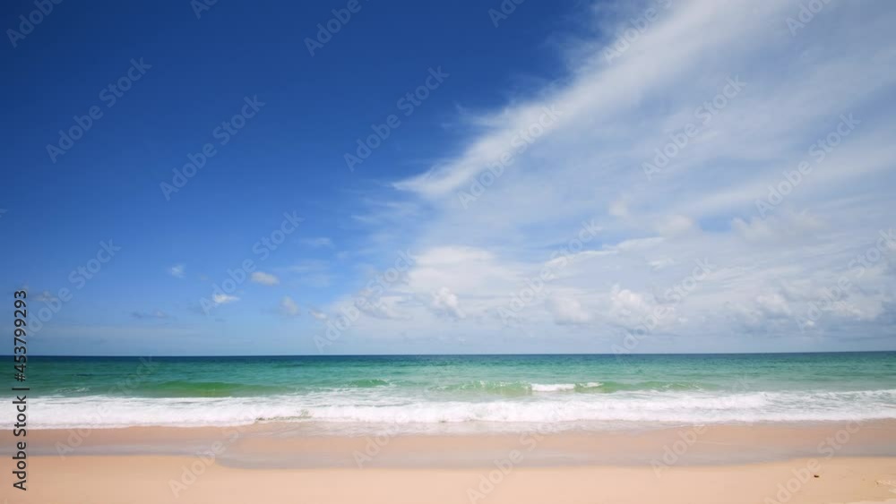 Phuket beach Thailand. Beautiful tropical beach with blue sky and clouds. Tropical beach with waves crashing empty beach. Andaman Sea sand and sky on beautiful summer day holiday Phuket beach Thailand. Beautiful tropical beach with blue sky and clouds. Tropical beach with waves crashing empty beach. Andaman Sea sand and sky on beautiful summer day holiday