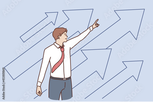 Business development and success concept. Young positive businessman standing pointing up with arrows feeling confident with growth and development vector illustration
