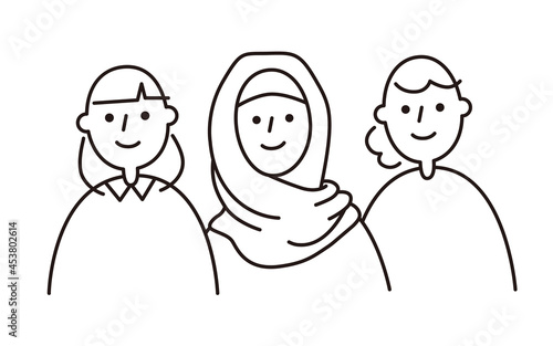 Three smiling women. One of the women is wearing a hijab.