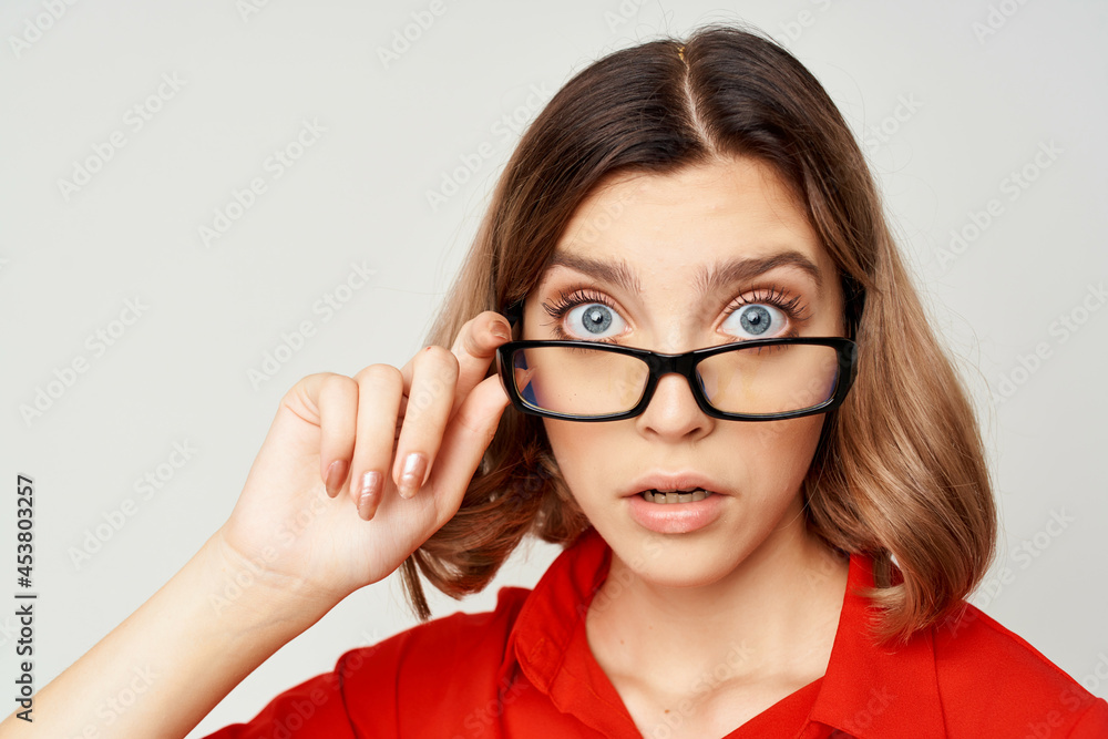 woman in red shirt wearing glasses emotions official office woman in red shirt wearing glasses emotions official office
