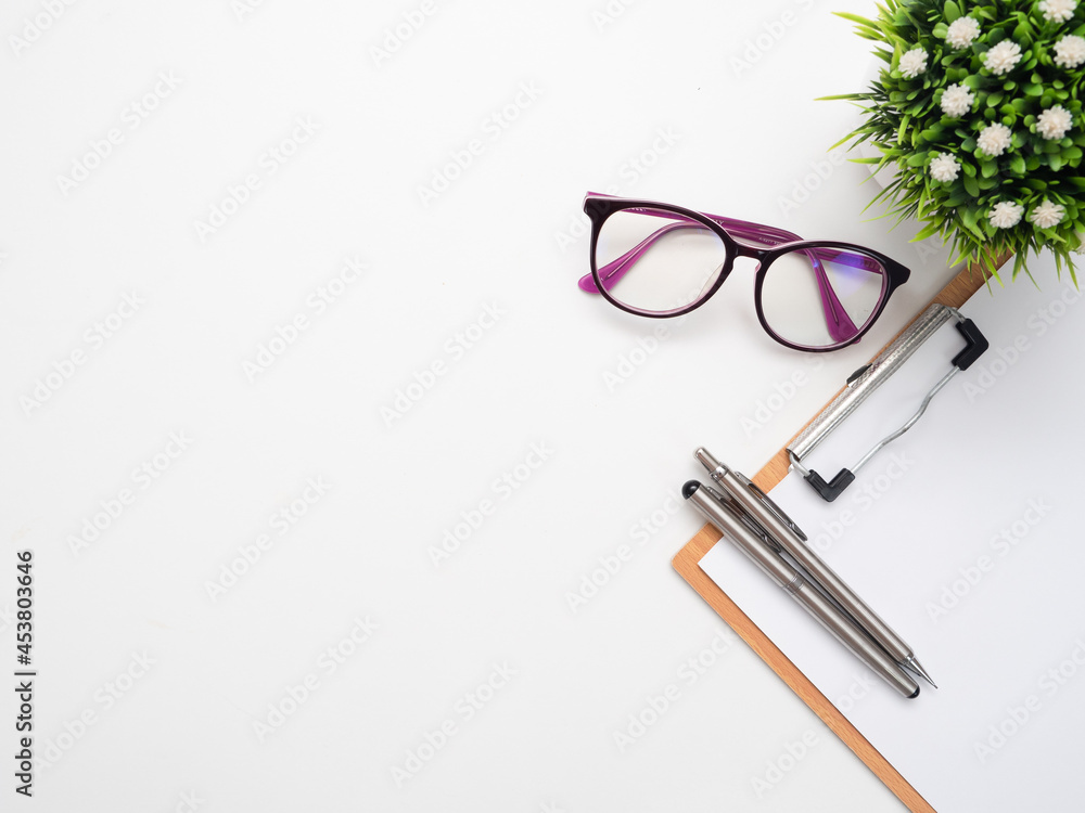 Close up pen on document poard and glasses top view copy space Close up pen on document poard and glasses top view copy space