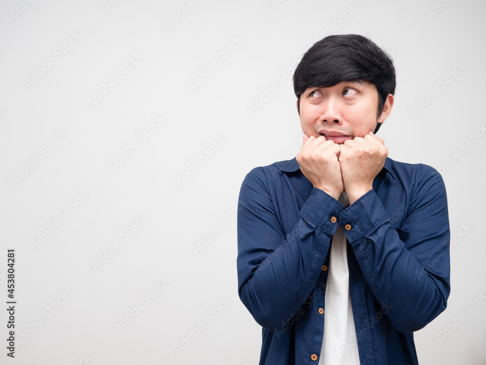Asian man gesture afraid and looking at copy space white isolated Asian man gesture afraid and looking at copy space white isolated