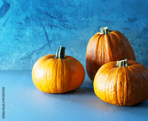 Orange pumpkin on a grey background