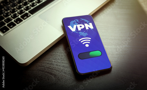 VPN - Virtual Private Network - Cyber Security and Privacy Data Encryption Software Solutions for Business concept. A smartphone with vpn app for anonymous internet using, unblock websites