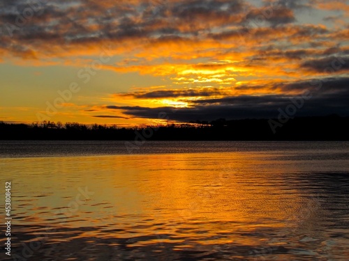 Sunrise on cloudy morning, at lake Simcoe, Ontario, Canada © Lucia