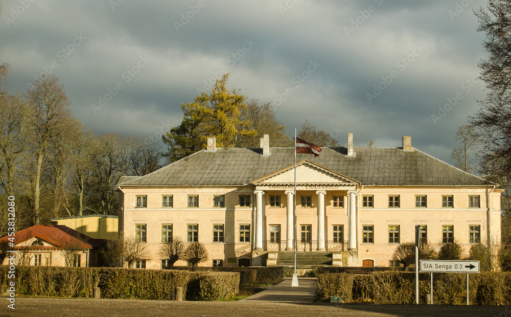 Old Vandzene manor in sunny autumn day, Latvia.