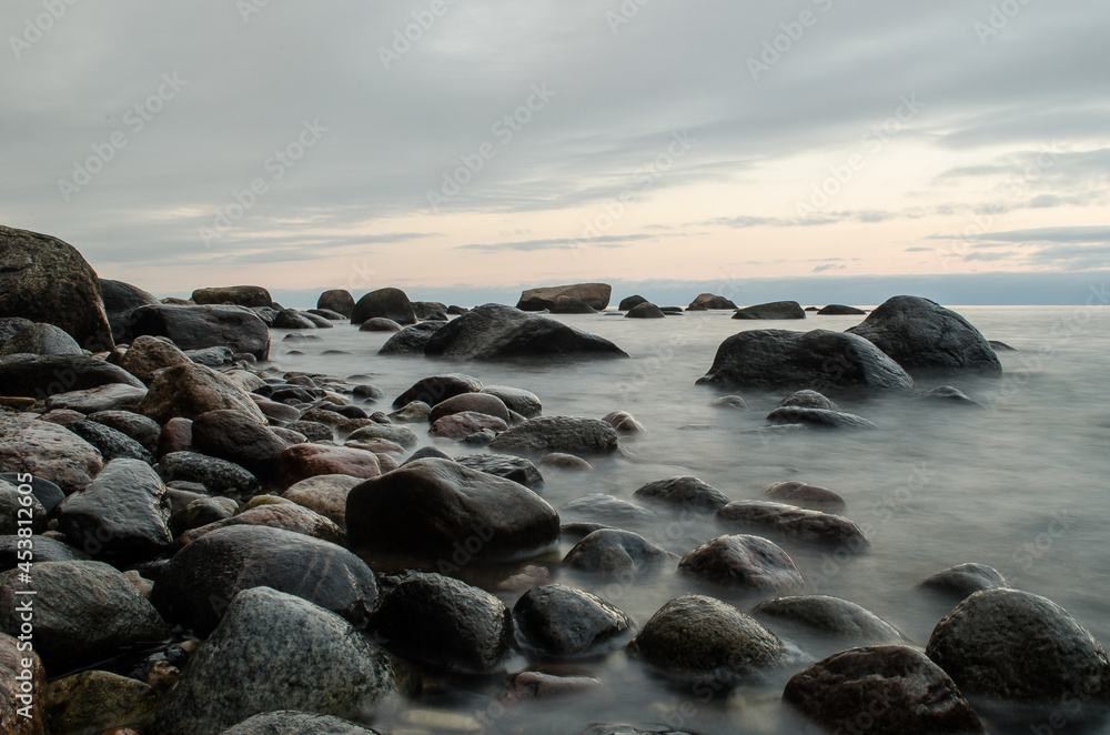 Seaside with big stones, long exposure photo. Seaside with big stones, long exposure photo.