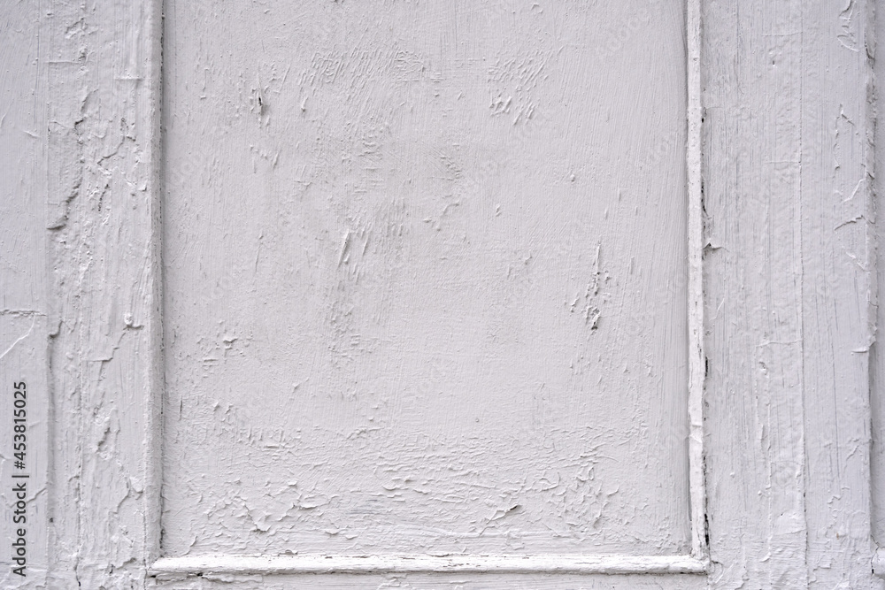 The texture of a wooden wall painted with white paint
