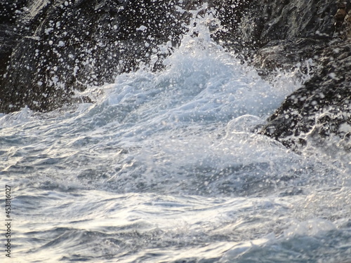 Wallpaper Mural waves crashing on rocks during sunset  in mediterranean August 29  2021  Torontodigital.ca