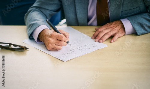 Scene of sign signature on paper document on table