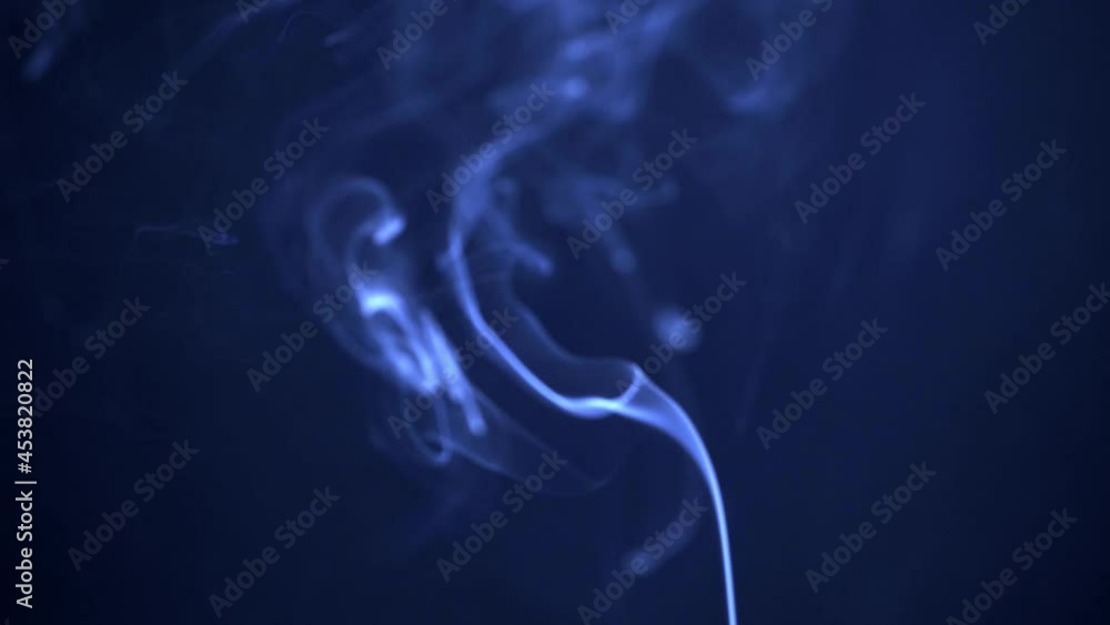 Soft flowing smoke on blue background. Abstract blue swirls of fog. Smooth chaotic rise of blue smoke. Slow Motion Soft flowing smoke on blue background. Abstract blue swirls of fog. Smooth chaotic rise of blue smoke. Slow Motion