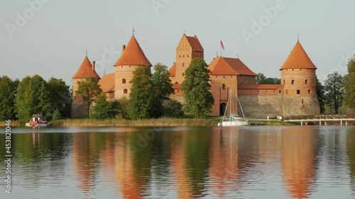 Trakai Island Castle in lake Galve on a summer day, Lithuania. Trakai Castle is one of the major tourist attractions of Lituania. photo