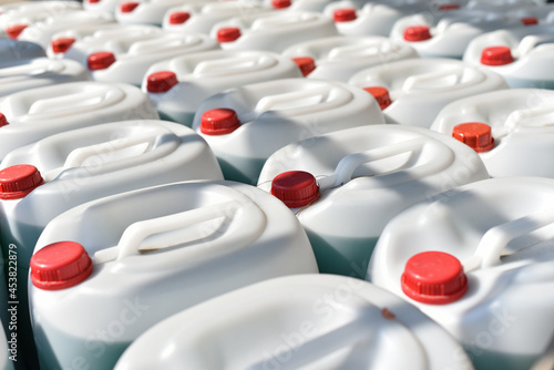 plastic canisters with windshield washer fluid photo