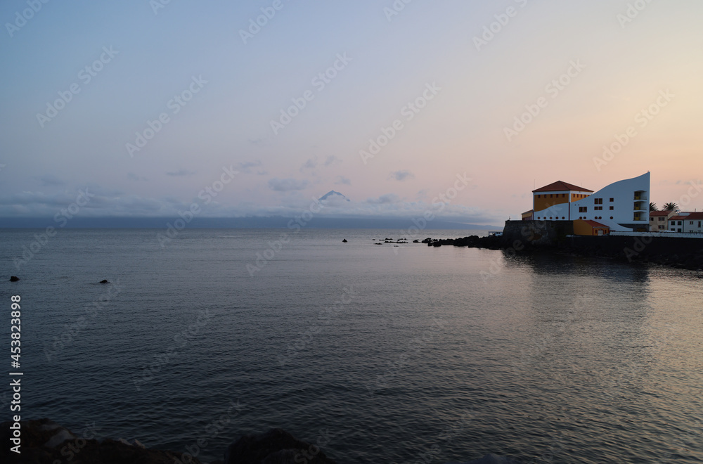 Sunset in the bay of Velas, in the island of Sao Jorge, Azores Sunset in the bay of Velas, in the island of Sao Jorge, Azores
