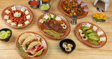 Mexican food served in clay dishes, on a wooden table