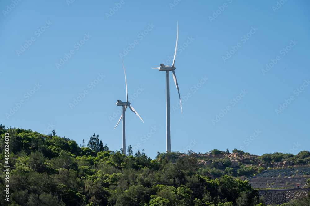 Under the blue sky, there was a windmill on the mountain Under the blue sky, there was a windmill on the mountain