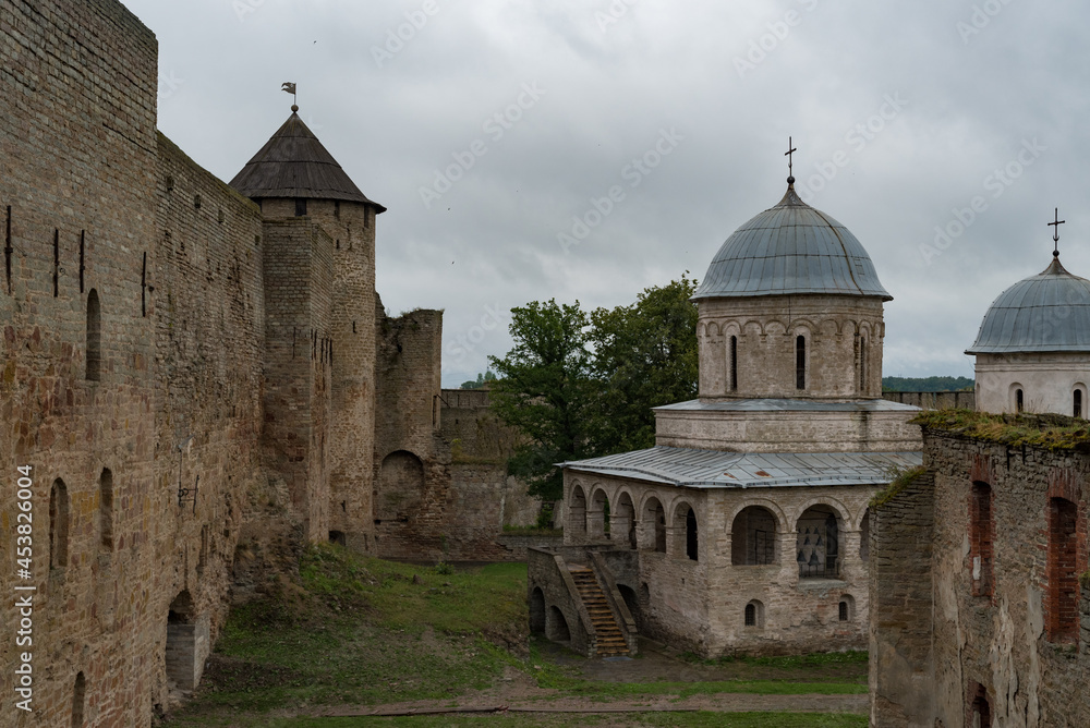 Ancient Church of Saint Nicholas and Church of Dormition of the Mother of God on territory of Ivangorod Fortress that was built in 1492. Ivangorod, Russia