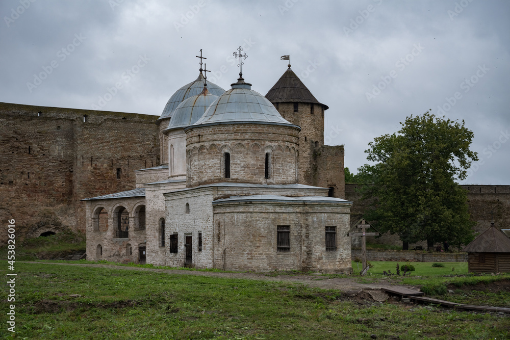 Ancient Church of Saint Nicholas and Church of Dormition of the Mother of God on territory of Ivangorod Fortress that was built in 1492. Ivangorod, Russia