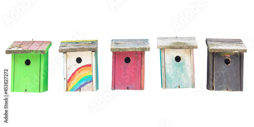Canvastavla Row of five weathered hand painted wooden bird houses isolated on white