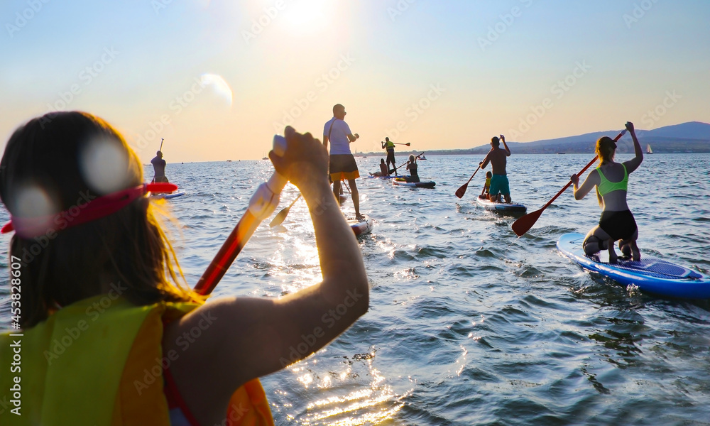 sup surfing in the sea
