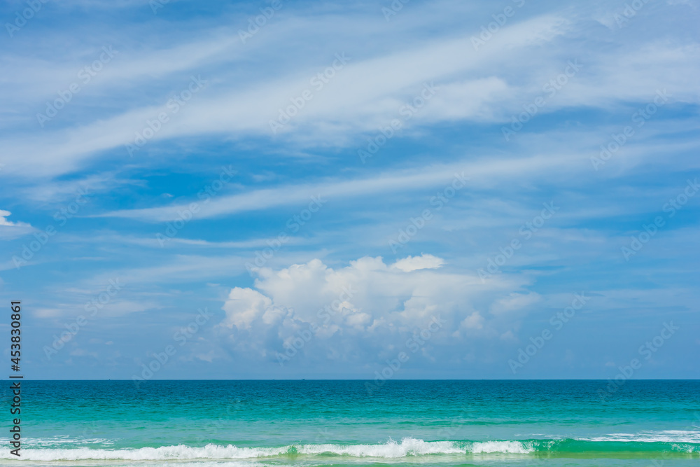 Landscape of sea beach sand and cloudy blue sky with sunny in nice weather day at Phuket sea Thailand.