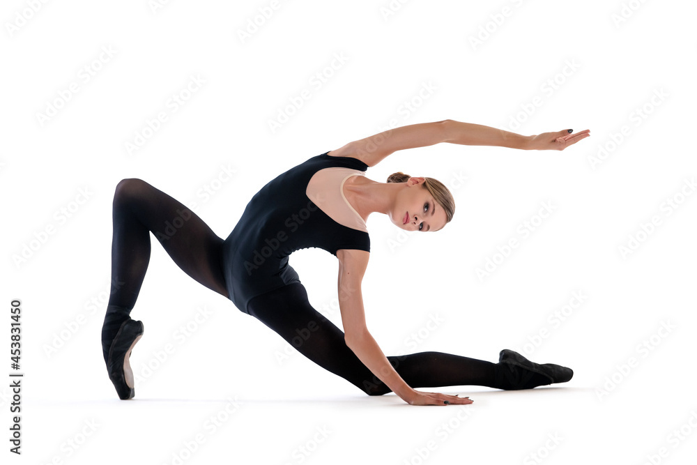 young ballerina in black pointe shoes and leotards posing in graceful pose, isolated on white background young ballerina in black pointe shoes and leotards posing in graceful pose, isolated on white background