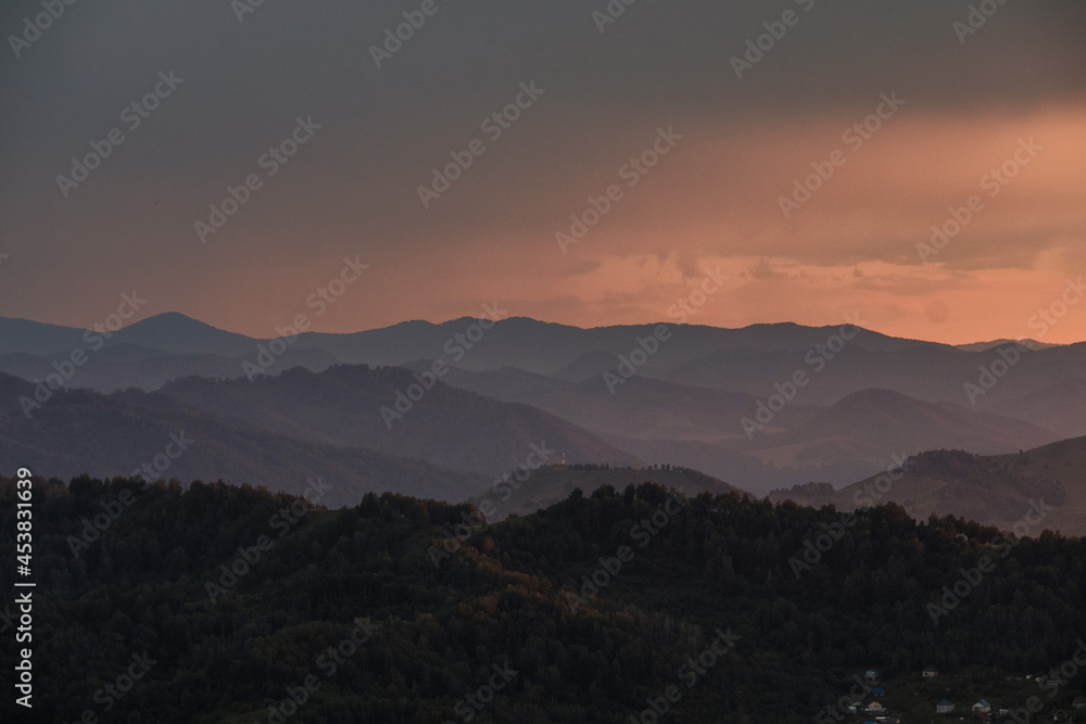 Fototapeta premium Sunset view of the mountains from the observation deck on Mount Tugaya