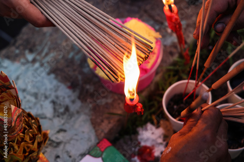 Chinese hungry ghost festival burning flame fire colourful variety prayer paper joss money fake currency joss stick mini fag food fruit