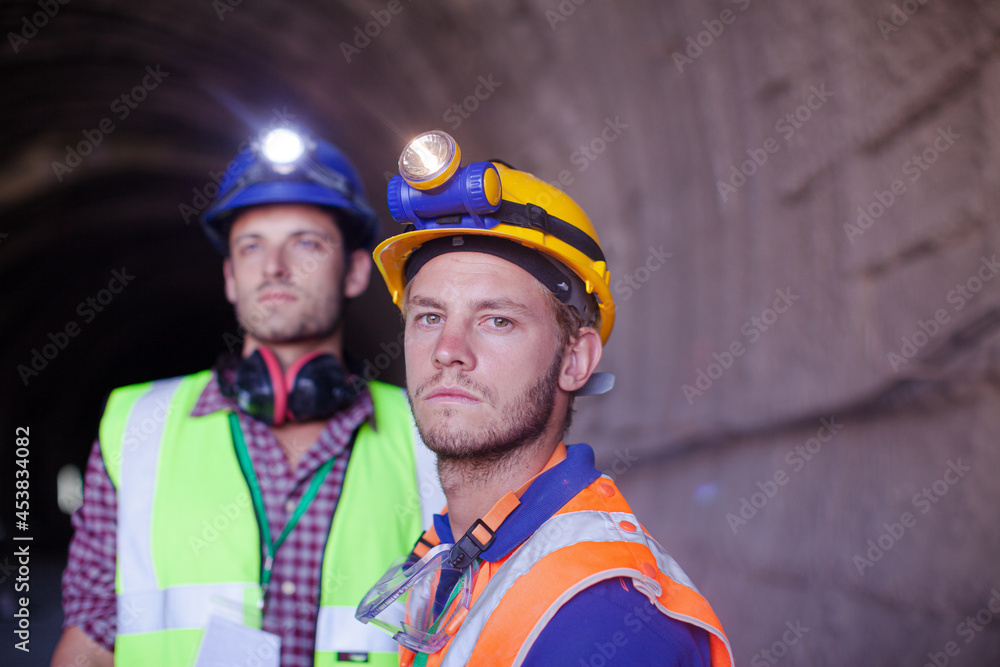 Business people talking in quarry Business people talking in quarry