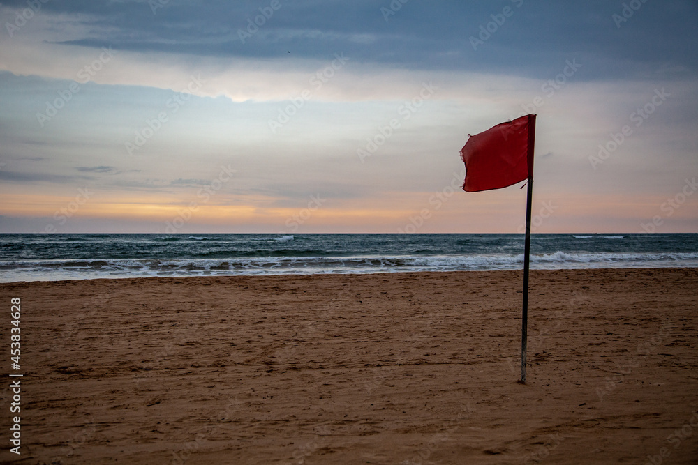 red flag on the beach