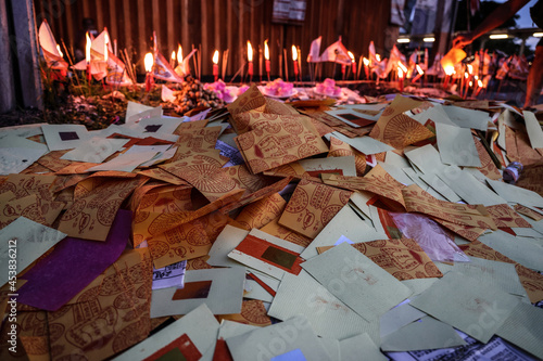 hinese hungry ghost festival burning flame fire glowing ashes firefly colourful variety prayer paper joss money fake currency joss stick mini fag food fruit offering photo