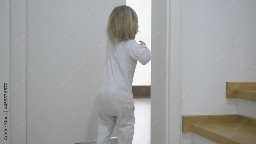 Funny little child open and shut the door, play, smile laughing, toddler play hide and seek indoor, fun in the house Funny little child open and shut the door, play, smile laughing, toddler play hide and seek indoor, fun in the house