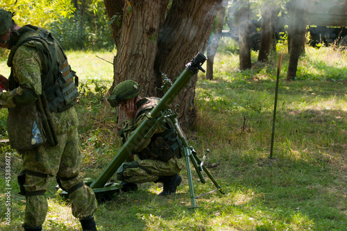 Mortar shot. The mortar crew performs firing practice