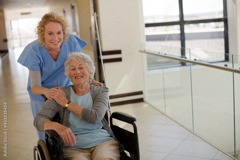 Portrait of smiling nurse and elderly patient in wheelchair Portrait of smiling nurse and elderly patient in wheelchair