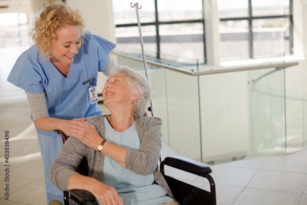 Portrait of smiling nurse and elderly patient in wheelchair Portrait of smiling nurse and elderly patient in wheelchair