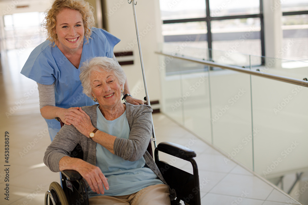 Portrait of smiling nurse and elderly patient in wheelchair Portrait of smiling nurse and elderly patient in wheelchair