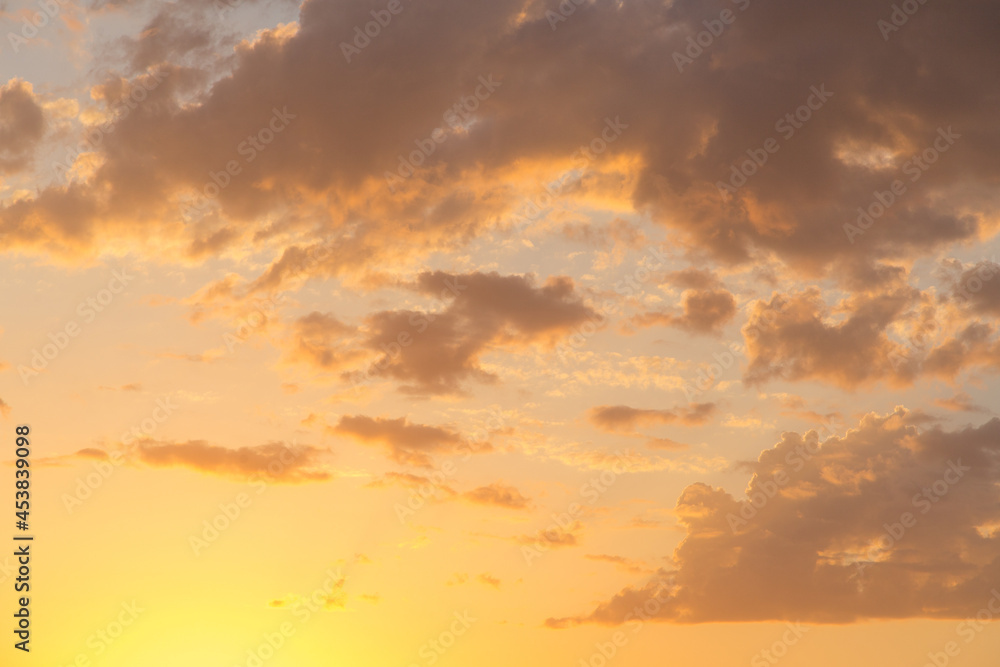 Golden sunset, clouds in the sky